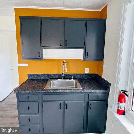 a kitchen with granite countertop cabinets and sink