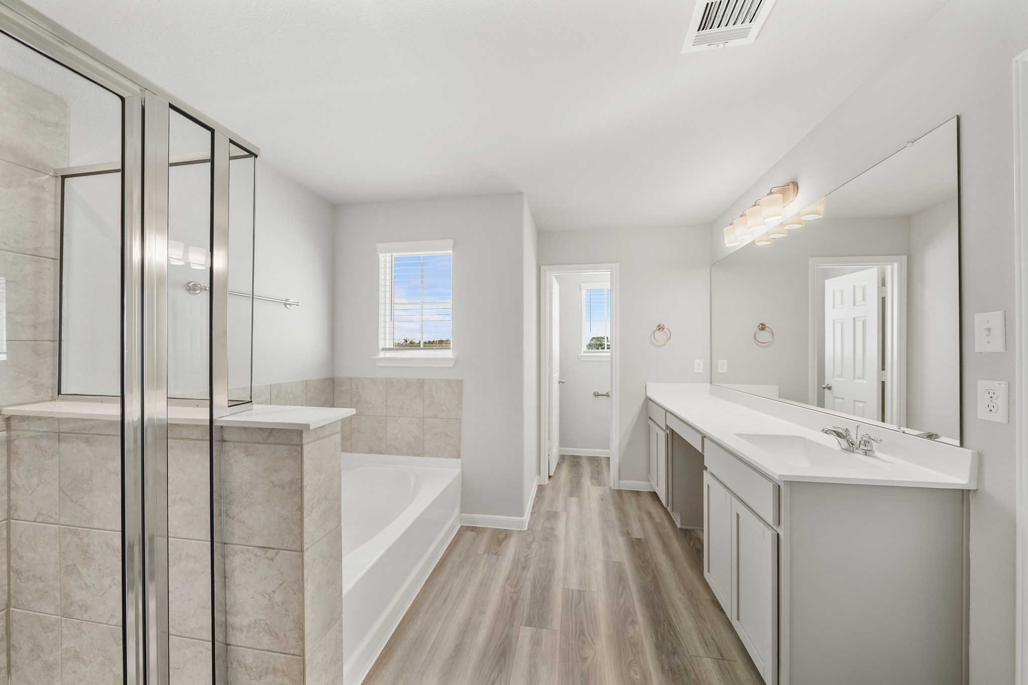 13309 Talisker Road Houston, TX 77048 - Photo 10 of 12 a bathroom with a tub sink and mirror