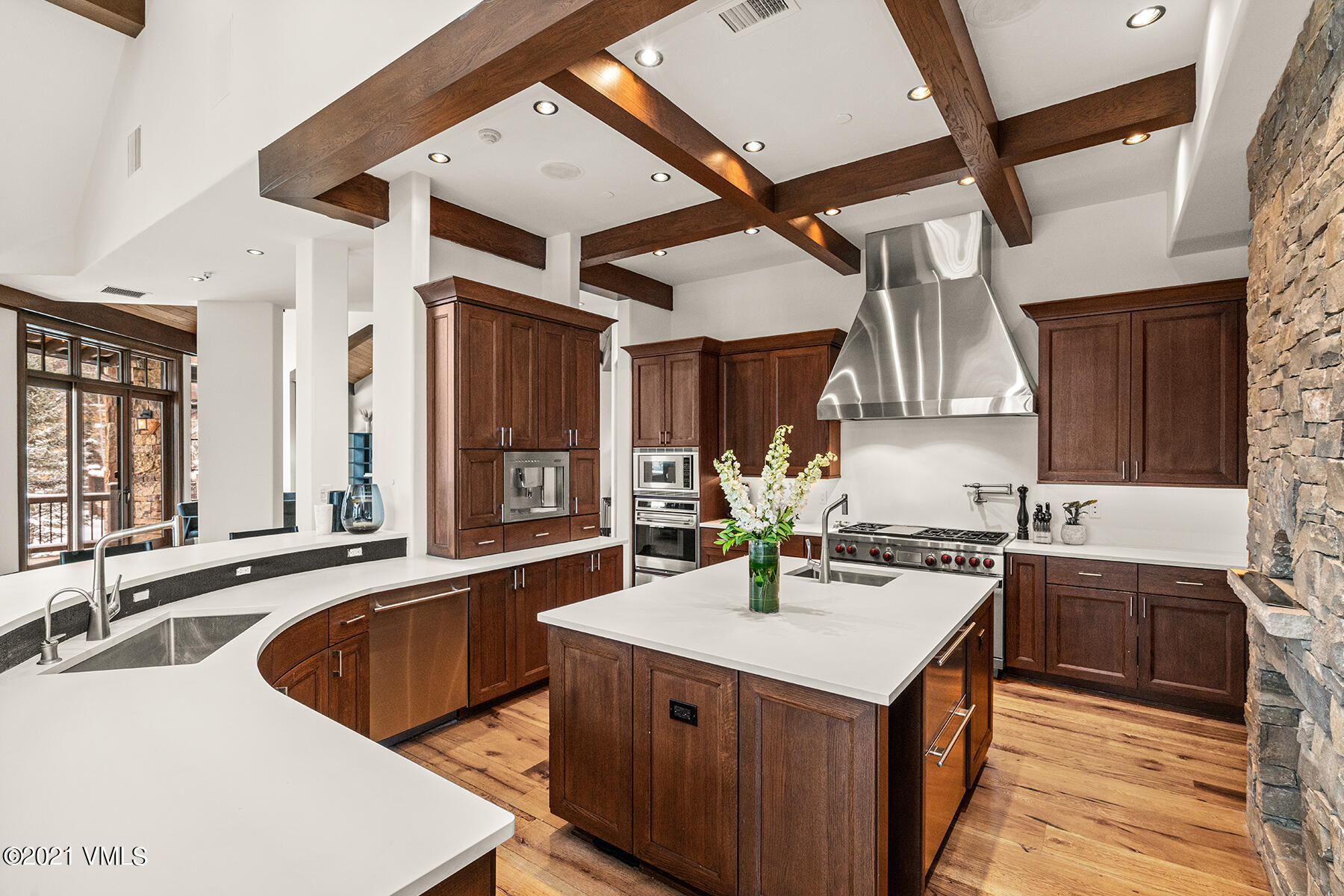 615 Forest Place Vail, CO 81657 - Photo 15 of 56 a kitchen with a sink stove and cabinets