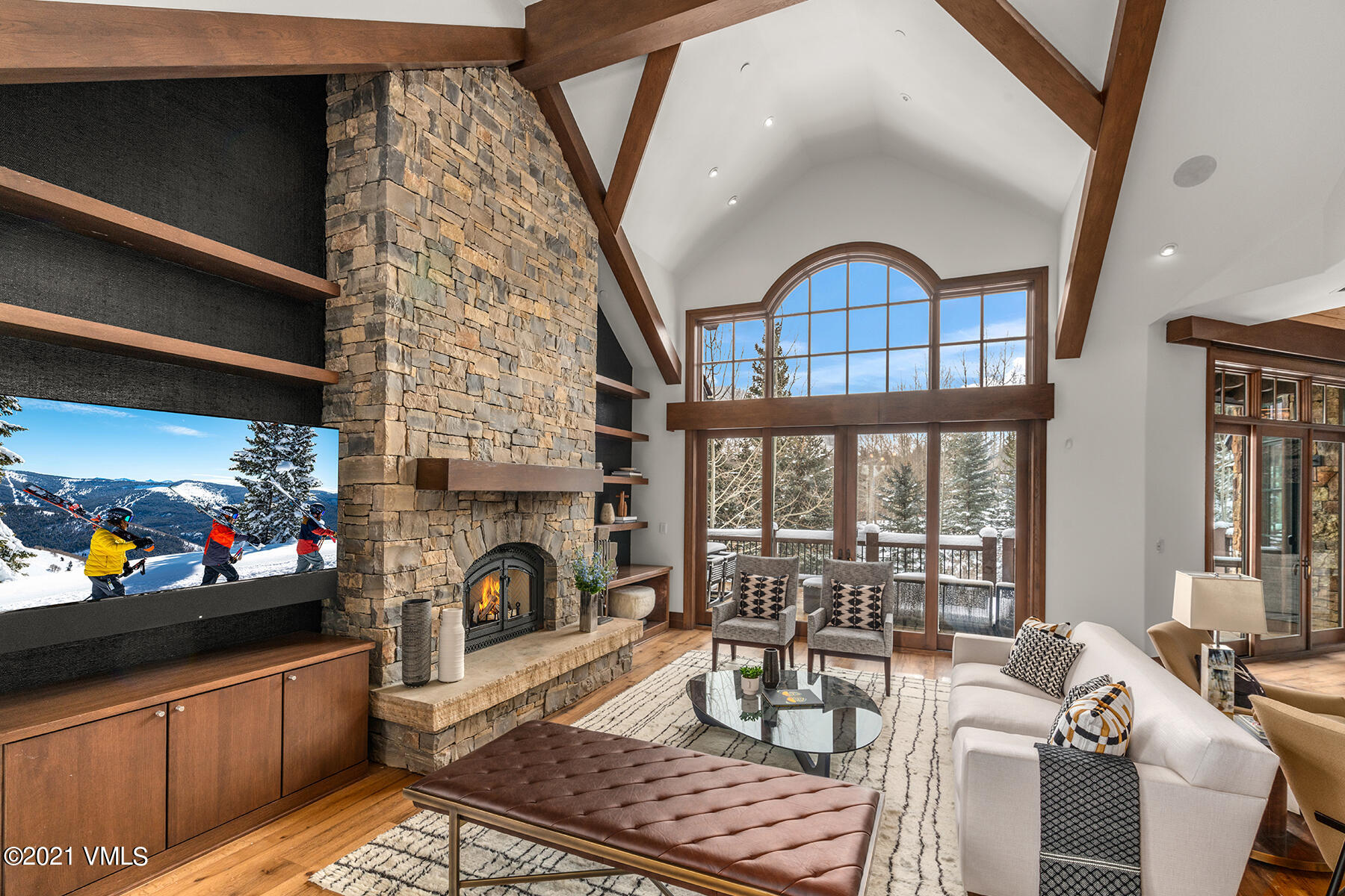 615 Forest Place Vail, CO 81657 - Photo 19 of 56 a living room with furniture a fireplace and a flat screen tv