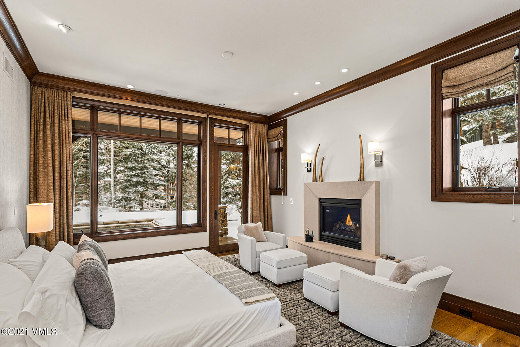 615 Forest Place Vail, CO 81657 - Photo 35 of 56 a spacious bedroom with a bed and a fireplace