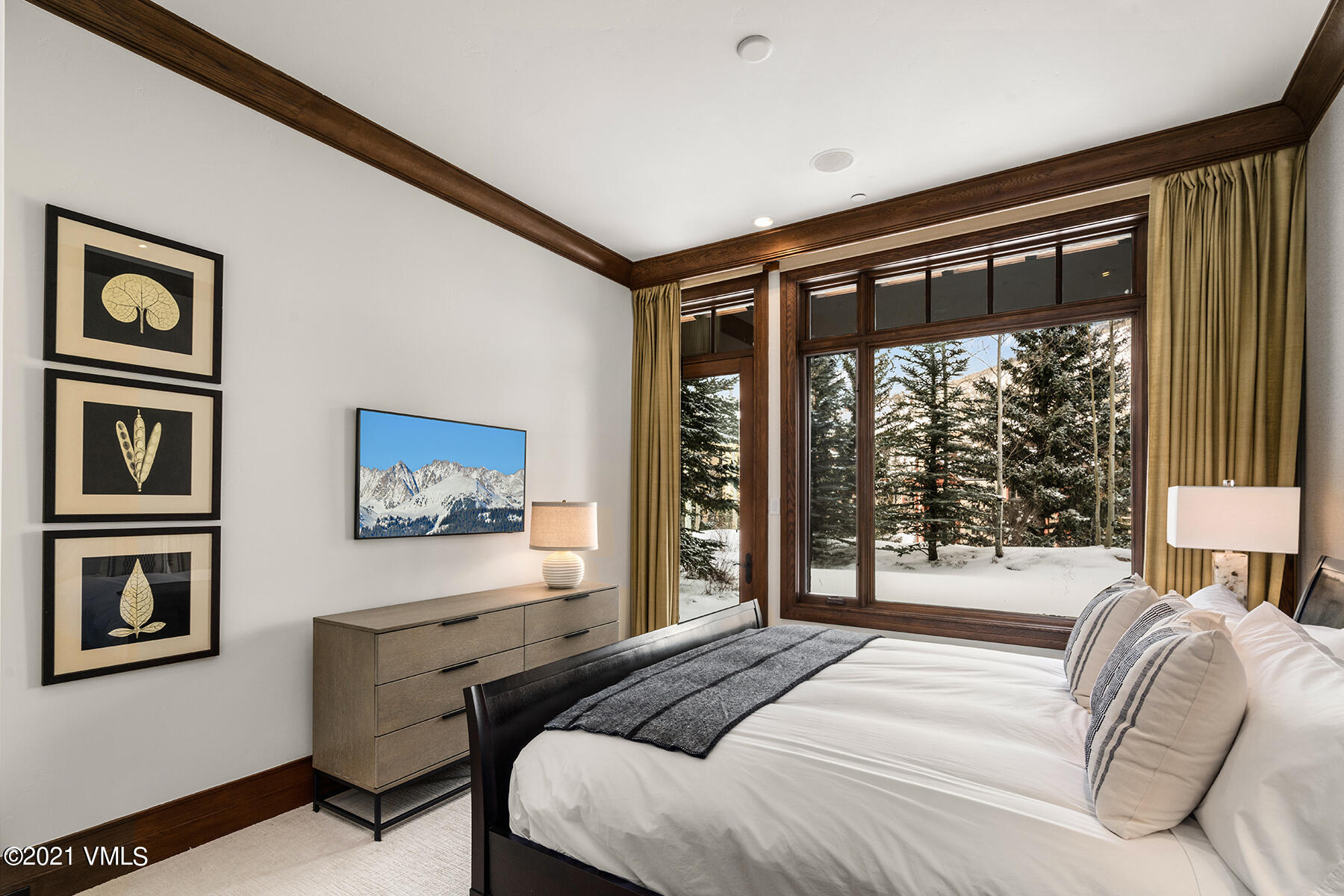 615 Forest Place Vail, CO 81657 - Photo 38 of 56 a bedroom with a bed and a large window