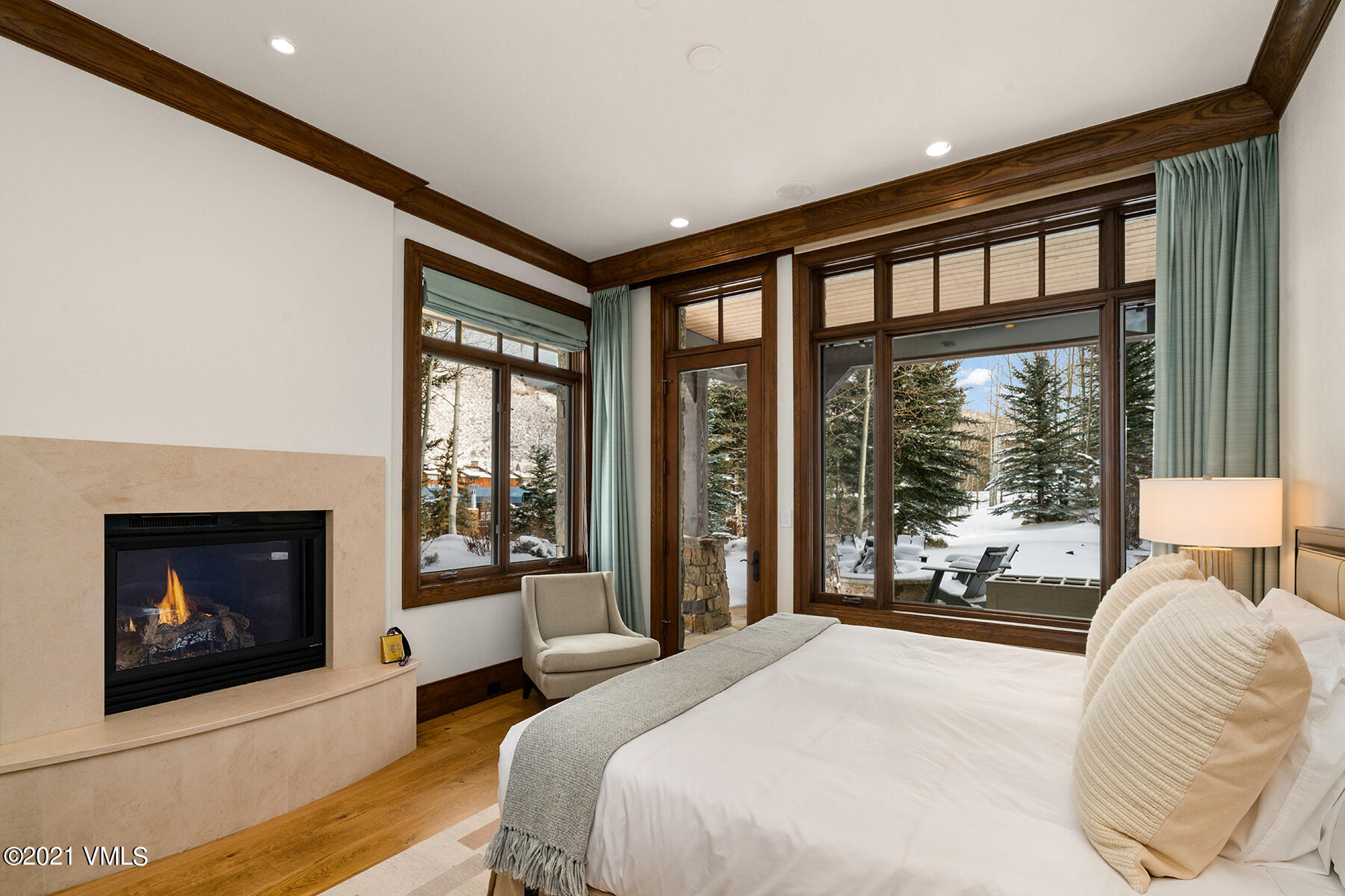 615 Forest Place Vail, CO 81657 - Photo 40 of 56 a bedroom with a large bed and a large window