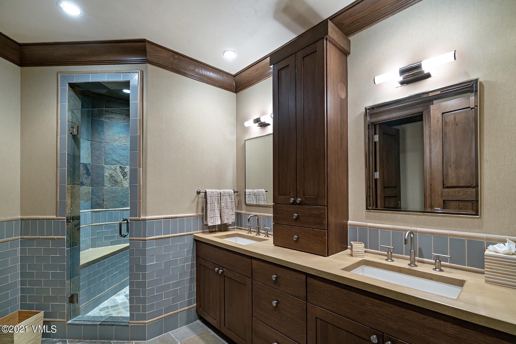 615 Forest Place Vail, CO 81657 - Photo 46 of 56 a bathroom with a double vanity sink and a mirror