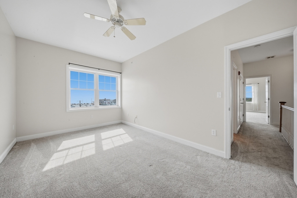 233 Beach Road, Unit A11 Salisbury, MA 01952 - Photo 20 of 37 a view of an empty room with a window