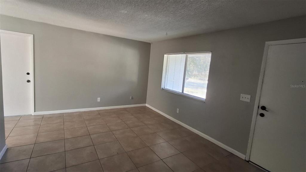 4720 Lighthouse Circle Orlando, FL 32808 - Photo 3 of 16 a view of an empty room with a window