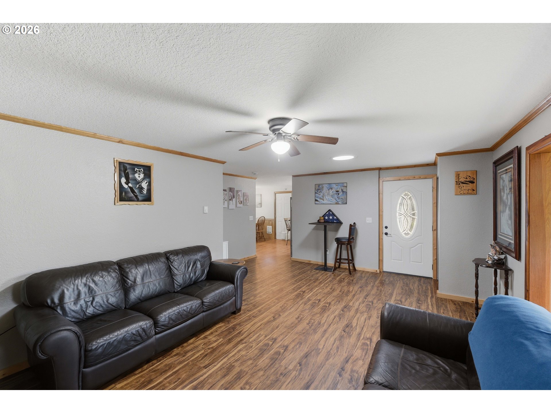 192 North Wood Ridge Road Coquille, OR 97423 - Photo 8 of 42 a living room with furniture and a chandelier