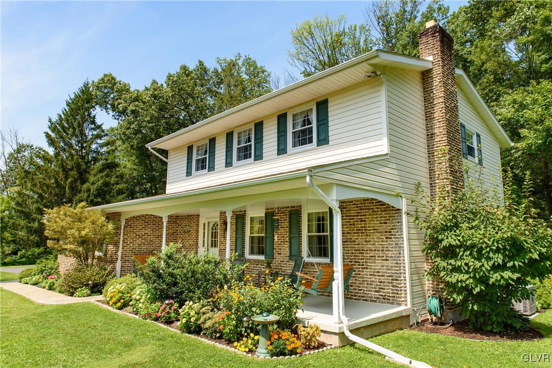 2186 East Best Road Bath, PA 18014 - Photo 1 of 40 a front view of a house with garden