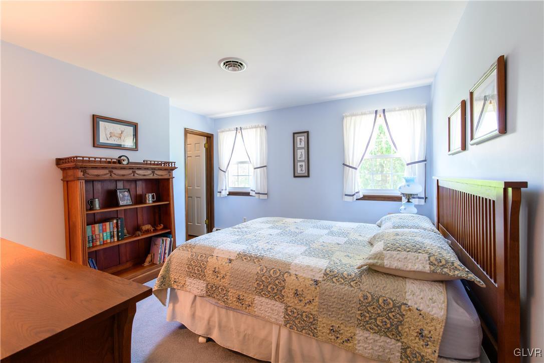 2186 East Best Road Bath, PA 18014 - Photo 33 of 40 a bedroom with a bed and a book shelf