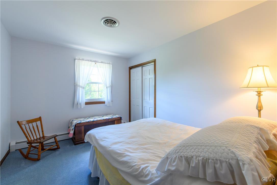 2186 East Best Road Bath, PA 18014 - Photo 34 of 40 a bedroom with a bed chair and window