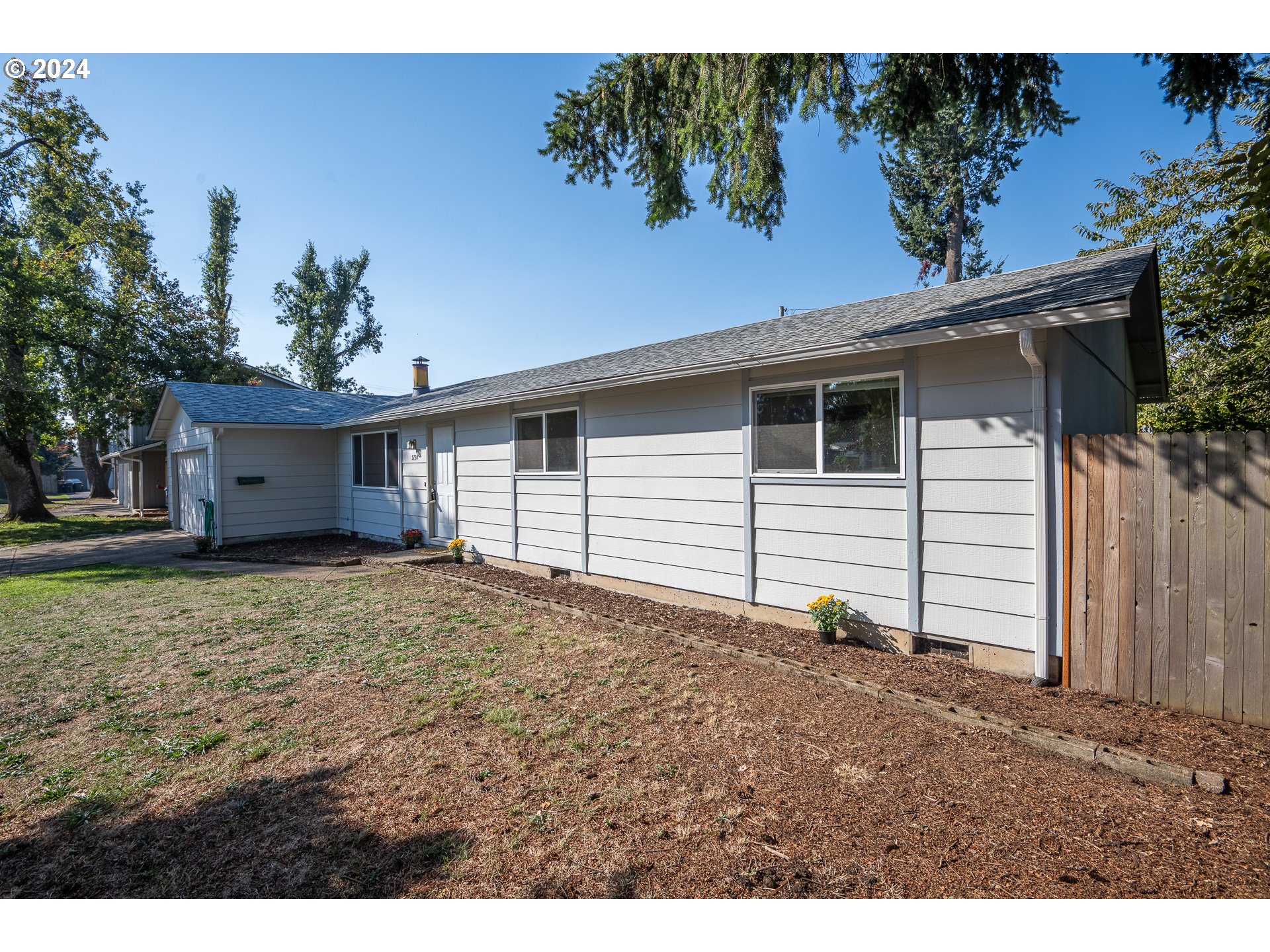 5124 E Street Springfield, OR 97478 - Photo 3 of 23 a view of a house with a backyard