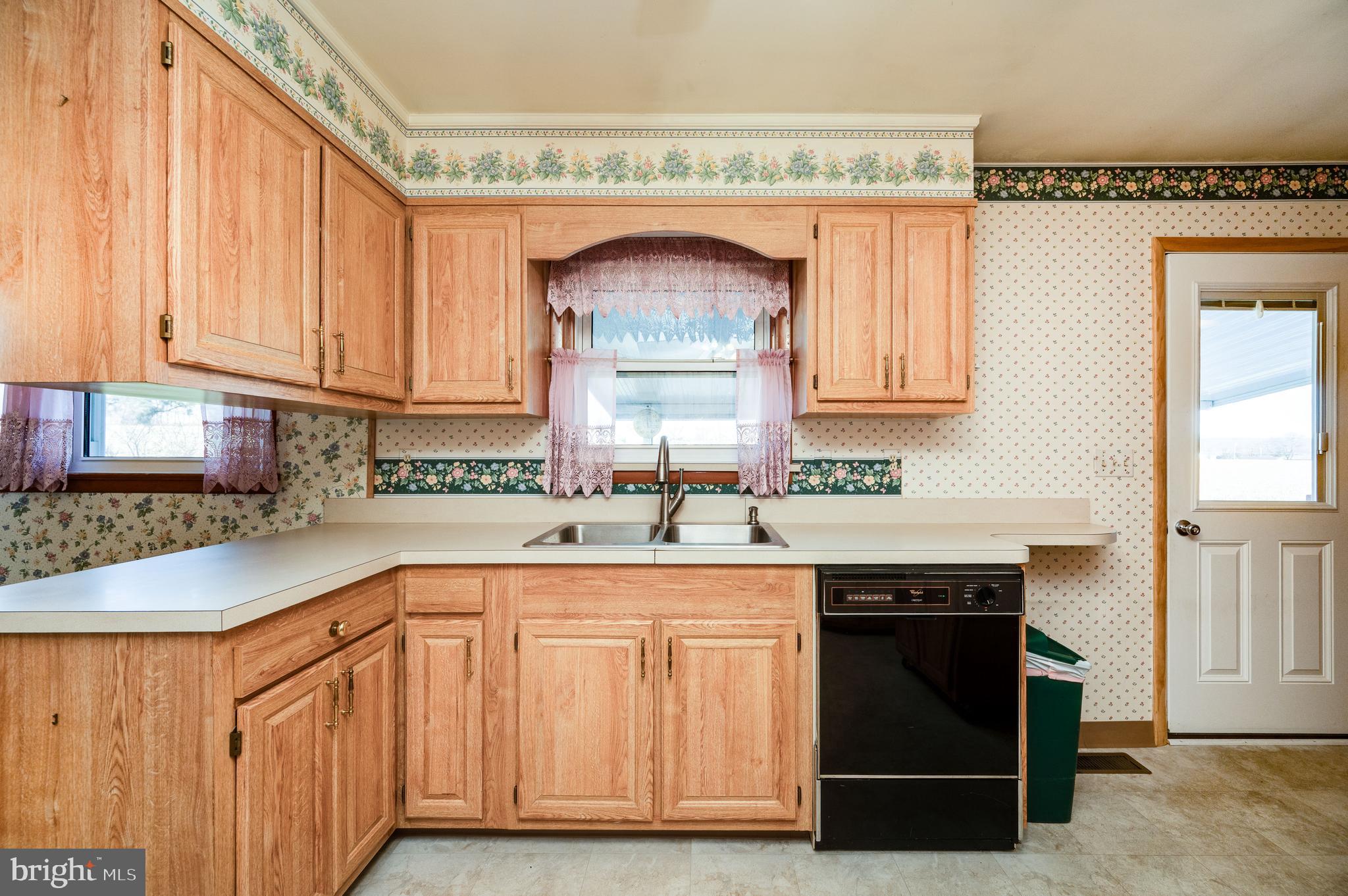 52 Crystal Cave Road Kutztown, PA 19530 - Photo 11 of 54 a kitchen with granite countertop a sink and a stove