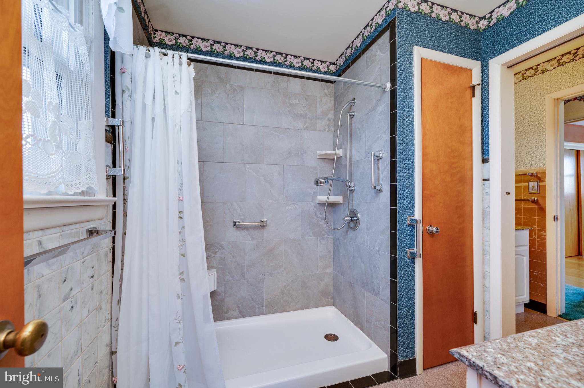 52 Crystal Cave Road Kutztown, PA 19530 - Photo 22 of 54 a bathroom with a glass shower door