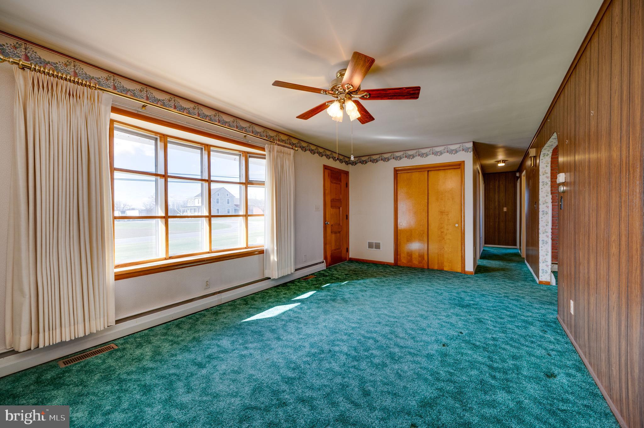 52 Crystal Cave Road Kutztown, PA 19530 - Photo 4 of 54 a view of empty room with window and ceiling fan