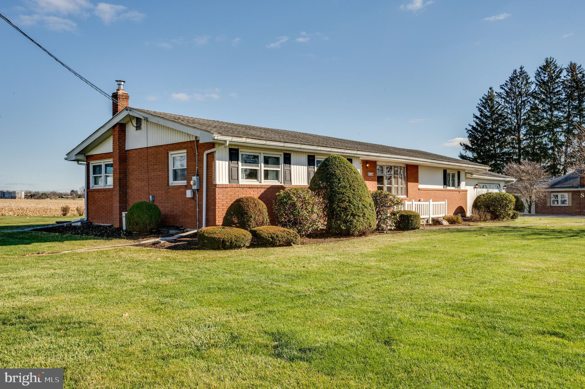 52 Crystal Cave Road Kutztown, PA 19530 - Photo 53 of 54 a front view of house with yard and trees in the background