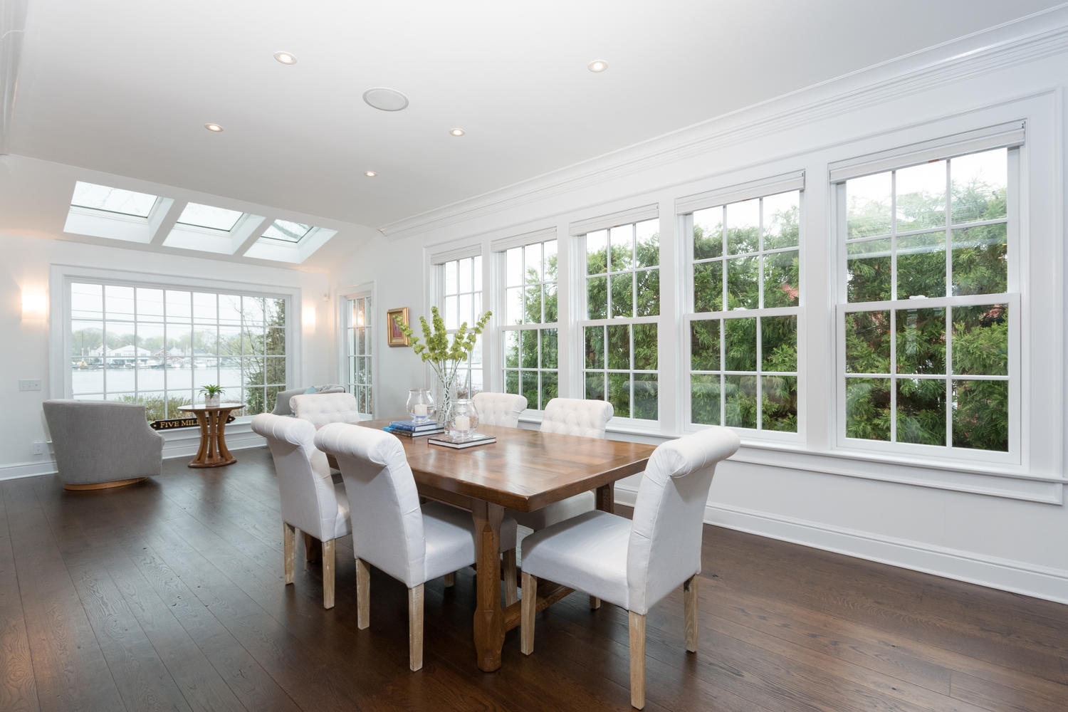 112 5 Mile River Road Darien, CT 06820 - Photo 11 of 34 a view of a dining room with furniture and wooden floor
