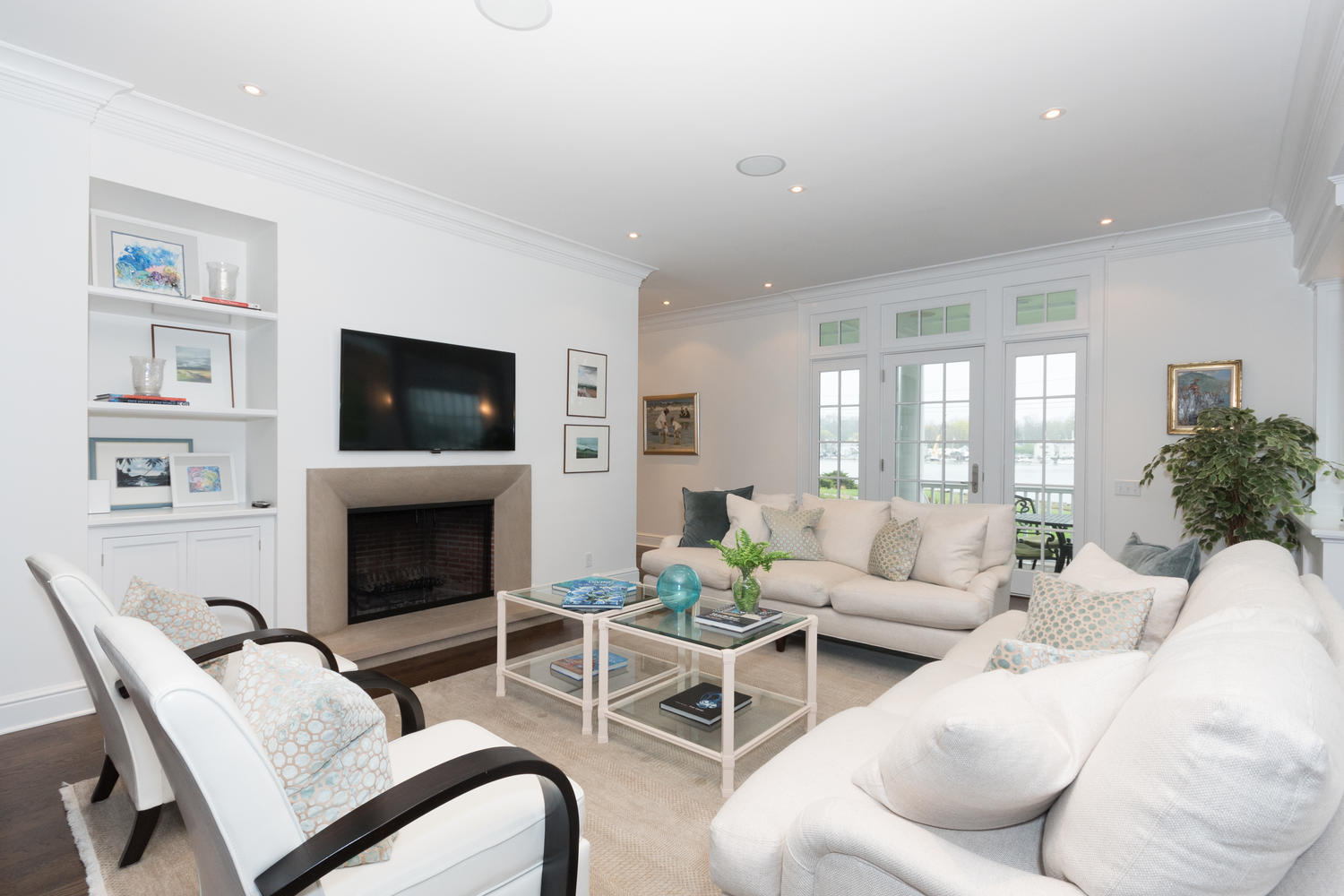 112 5 Mile River Road Darien, CT 06820 - Photo 12 of 34 a living room with furniture and a fireplace