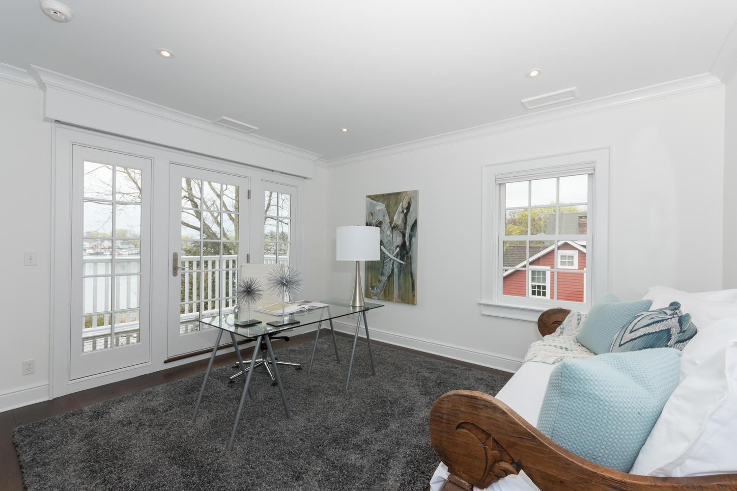 112 5 Mile River Road Darien, CT 06820 - Photo 20 of 34 a living room with furniture and a large window