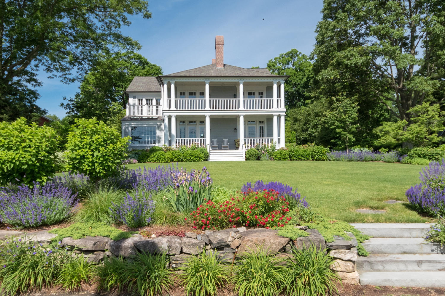 112 5 Mile River Road Darien, CT 06820 - Photo 2 of 34 a front view of a house with a yard
