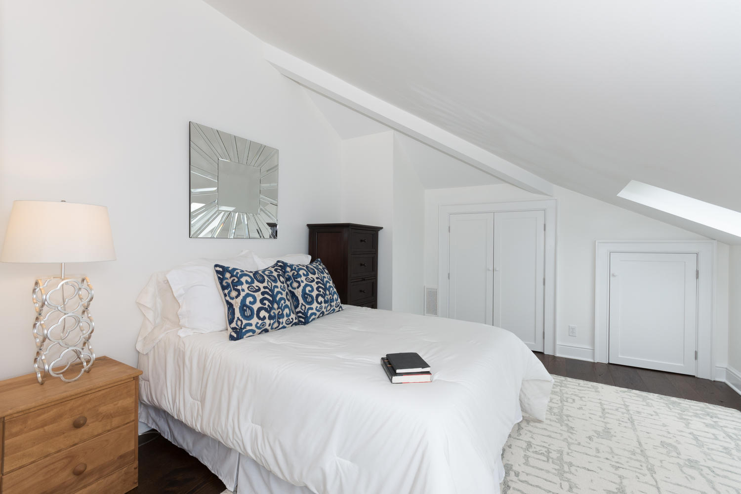 112 5 Mile River Road Darien, CT 06820 - Photo 27 of 34 a bedroom with a bed and a night stand