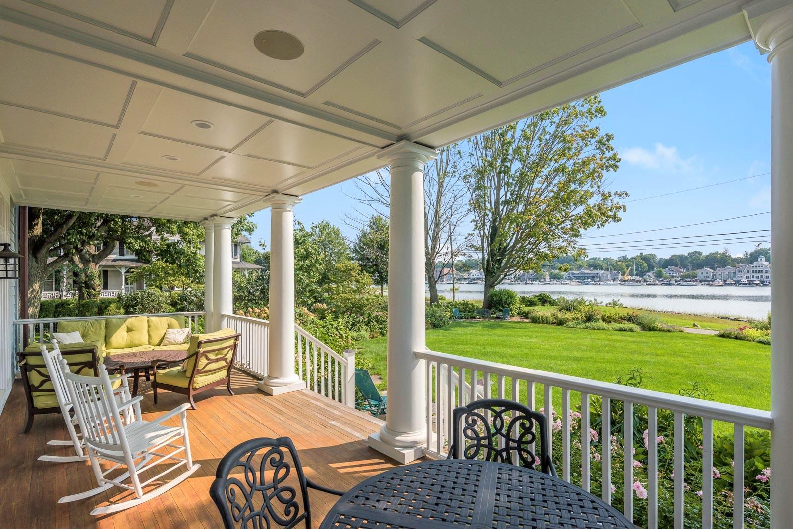 112 5 Mile River Road Darien, CT 06820 - Photo 3 of 34 a view of a patio with a table chairs and garden