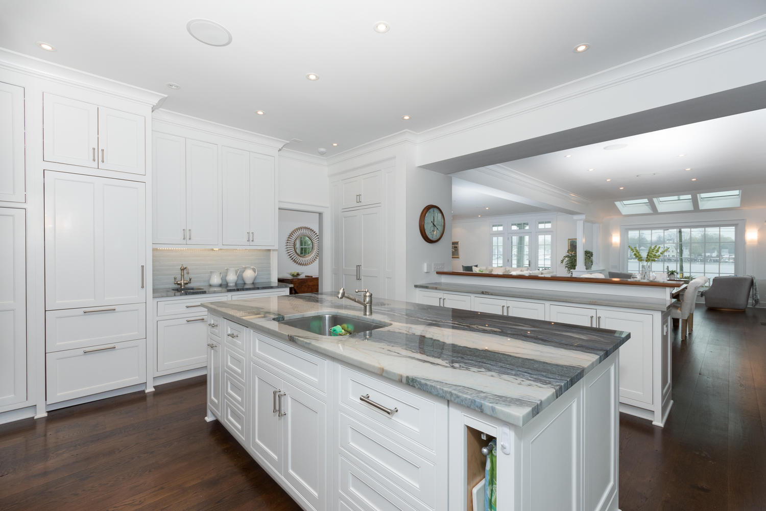 112 5 Mile River Road Darien, CT 06820 - Photo 9 of 34 a kitchen with white cabinets and sink