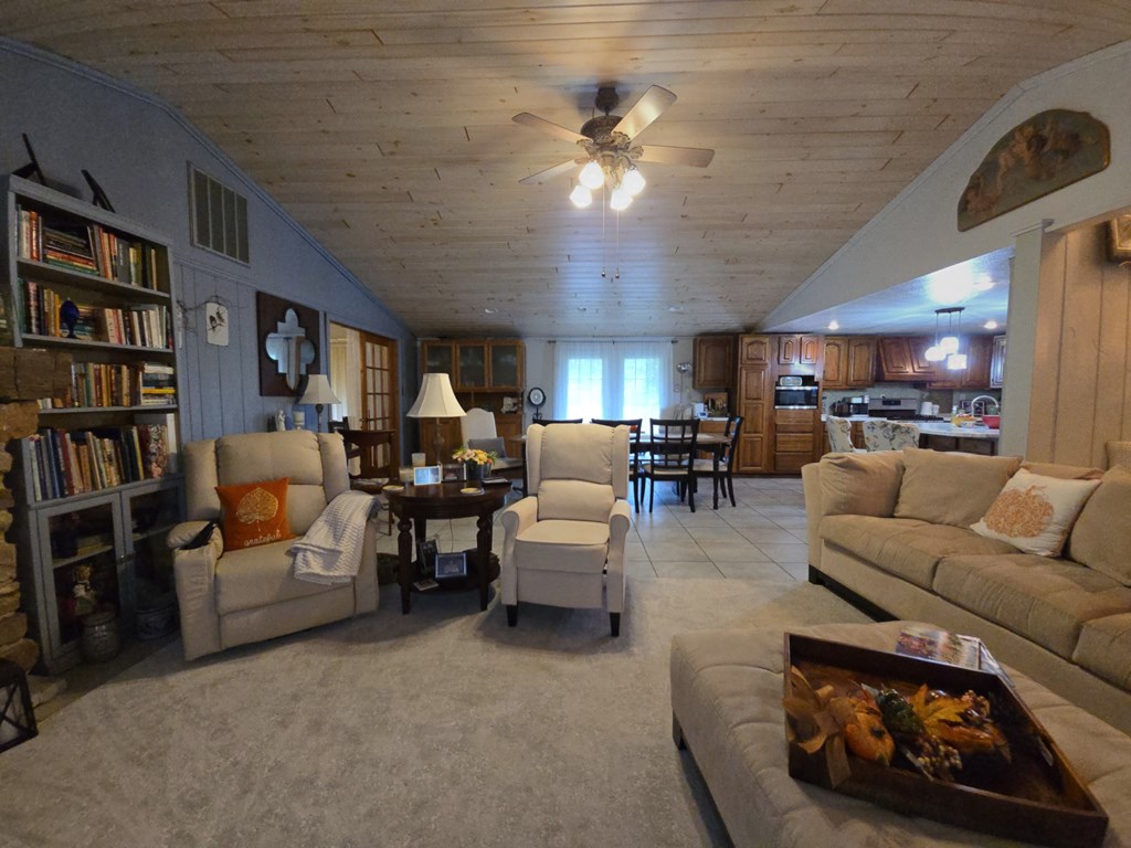 1405 Madison Road Templeton, PA 16259 - Photo 13 of 50 a living room with furniture and a book shelf