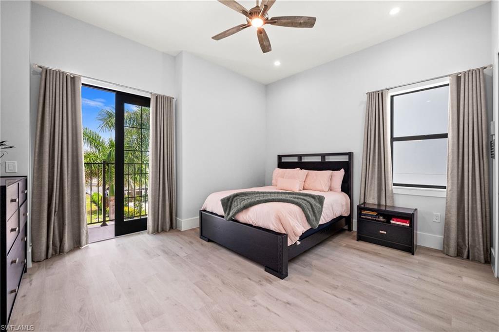 388 Pine Avenue Naples, FL 34108 - Photo 30 of 34 a bedroom with a bed and a large window