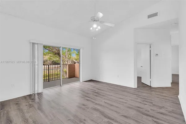 a bedroom with a bed and a potted plant
