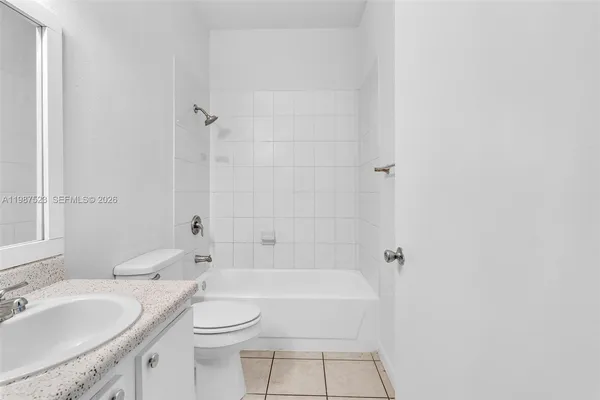 a view of a car park in front of a house