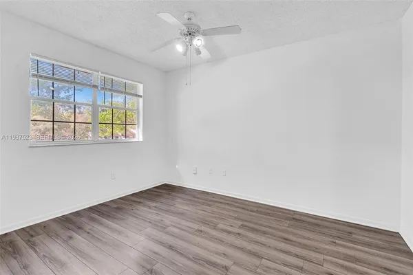 a view of a livingroom with wooden floor