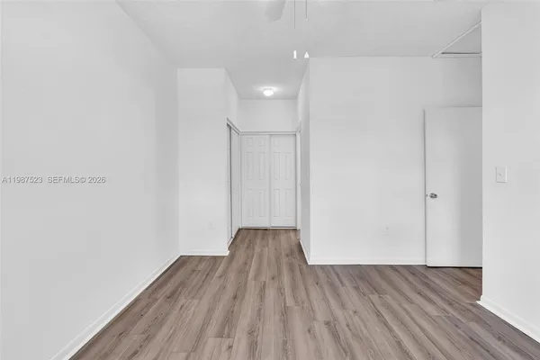 a kitchen with stainless steel appliances granite countertop a refrigerator sink stove and cabinets