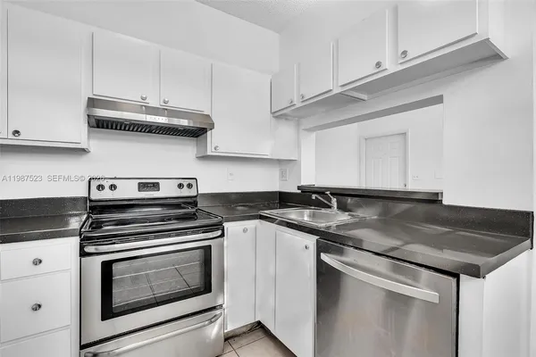 a view of outdoor space with playground and green space