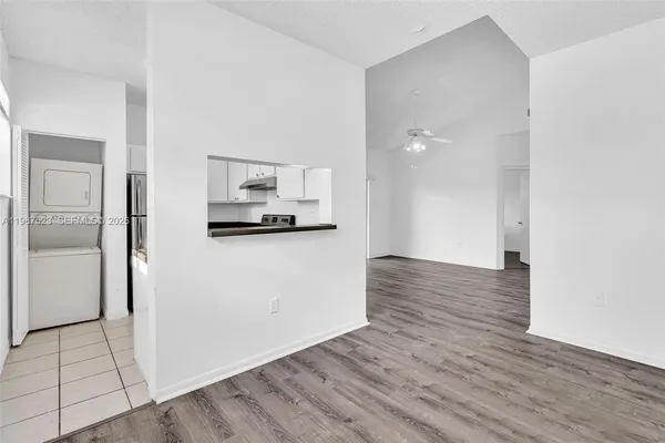 a kitchen with cabinets and steel stainless steel appliances
