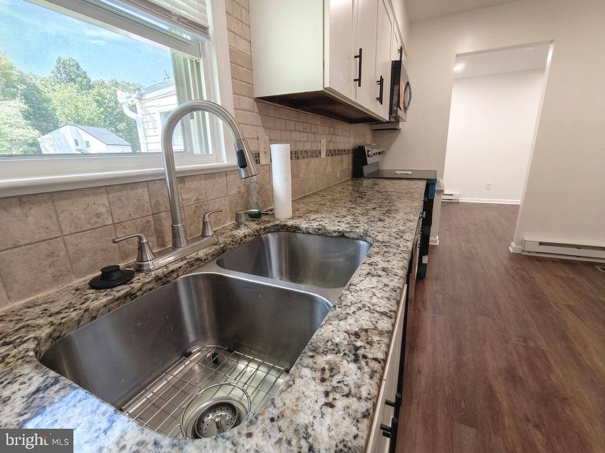 6066 Shady Side Road Shady Side, MD 20764 - Photo 20 of 61 Modern kitchen with sleek finishes.