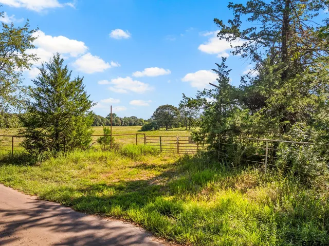 a view of a lake with houses in the back