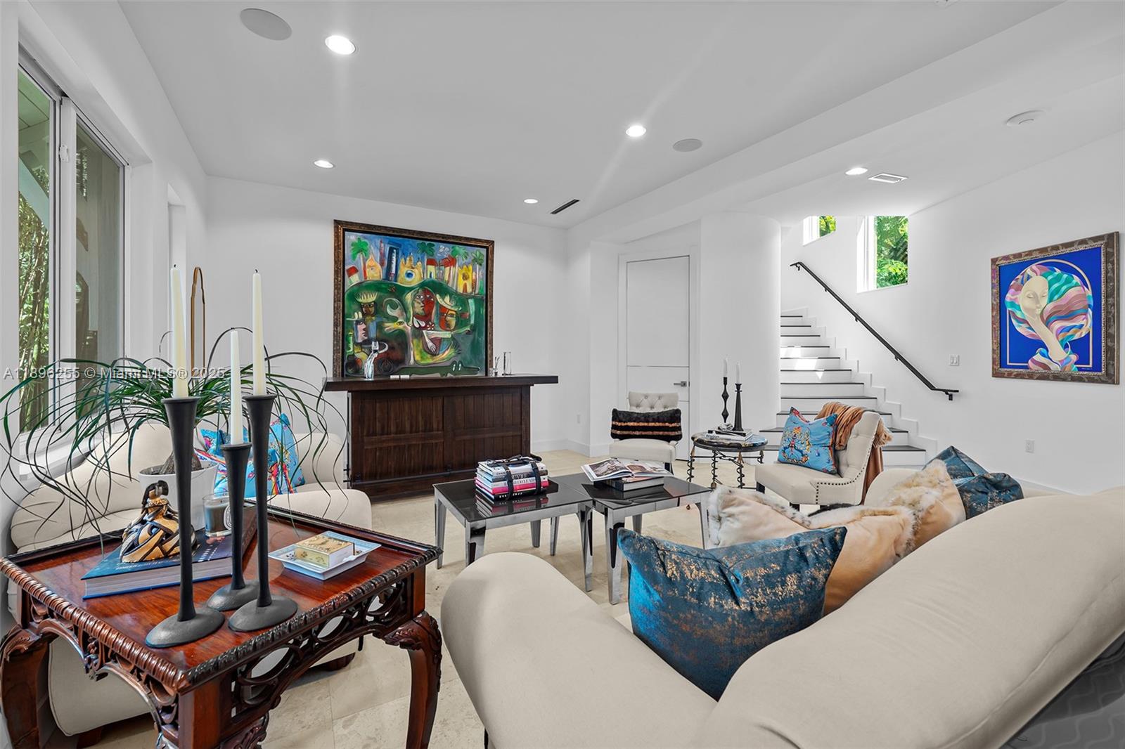 8923 Ludlam Road Pinecrest, FL 33156 - Photo 11 of 69 a living room with furniture flat screen tv and a potted plant