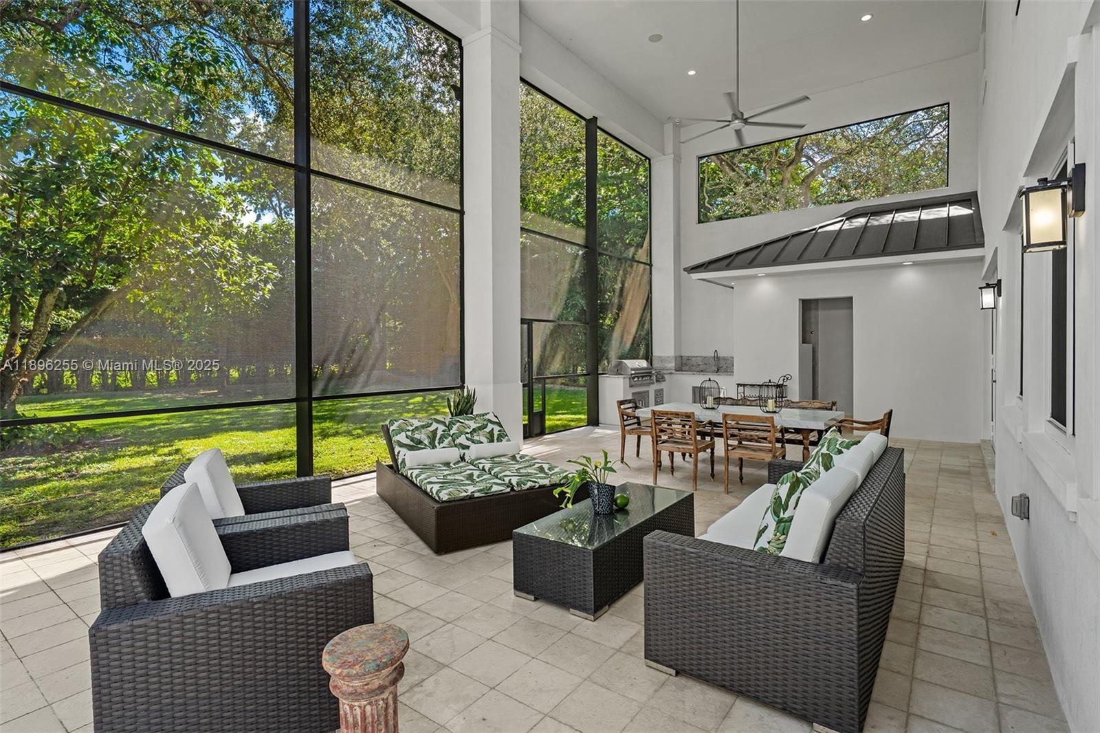 8923 Ludlam Road Pinecrest, FL 33156 - Photo 26 of 69 a living room with patio furniture and a garden