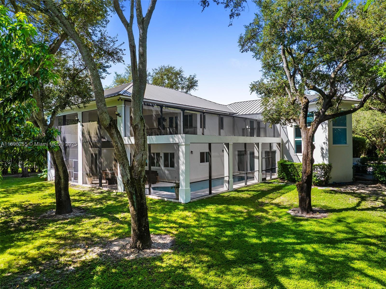 8923 Ludlam Road Pinecrest, FL 33156 - Photo 27 of 69 a view of a house with yard and a tree