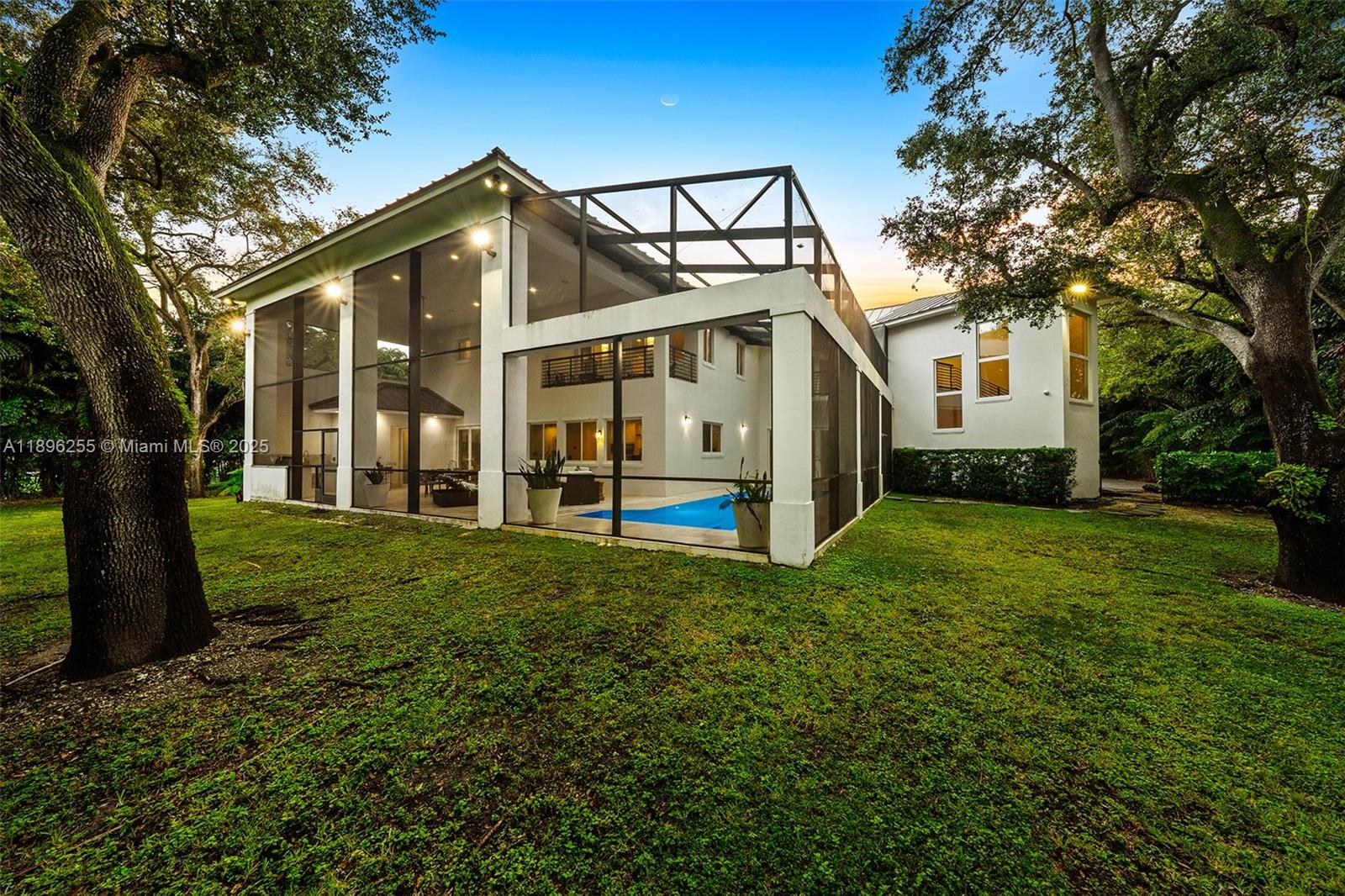 8923 Ludlam Road Pinecrest, FL 33156 - Photo 28 of 69 a view of a house with a yard
