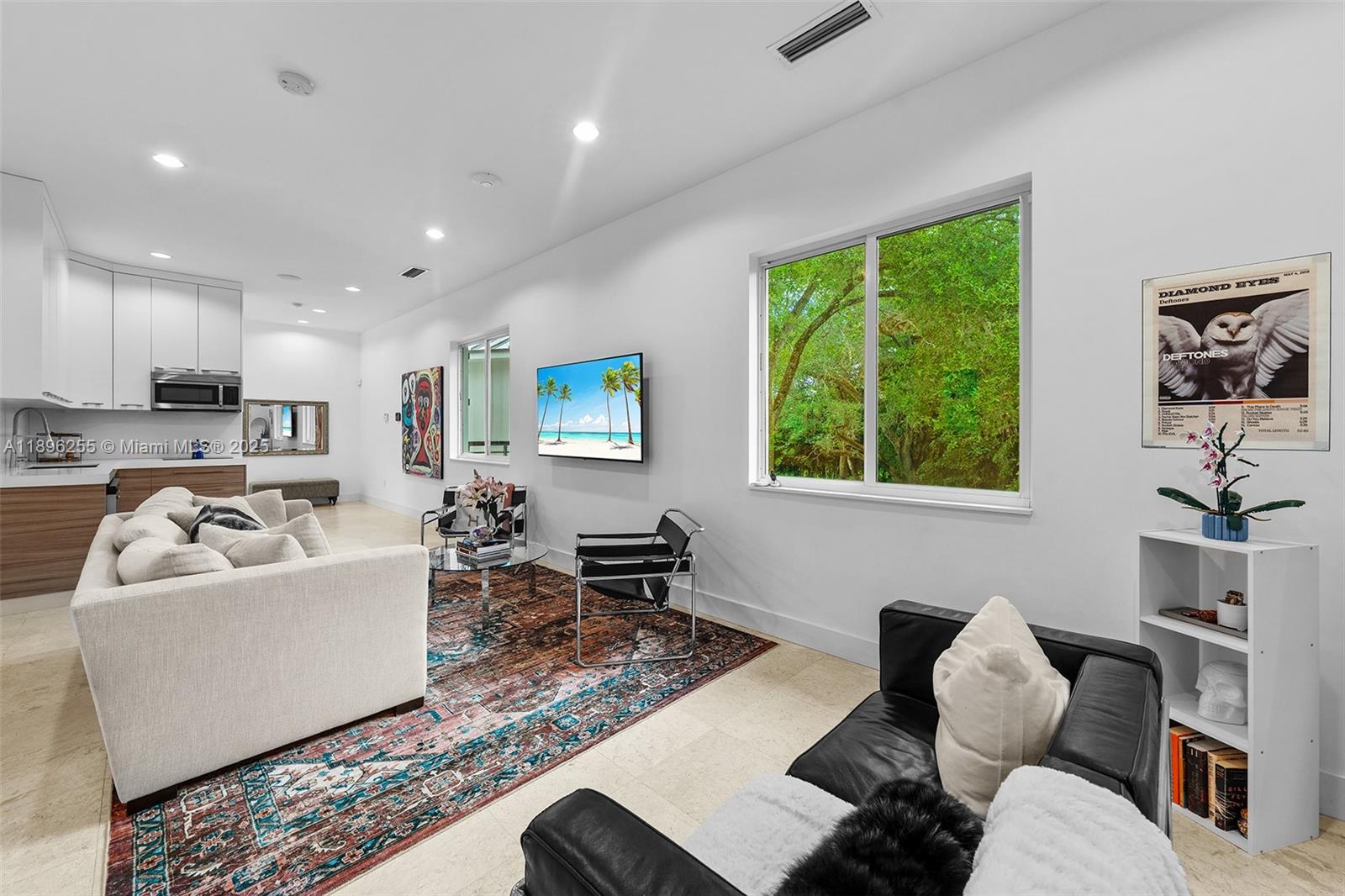 8923 Ludlam Road Pinecrest, FL 33156 - Photo 51 of 69 a living room with furniture and a large window