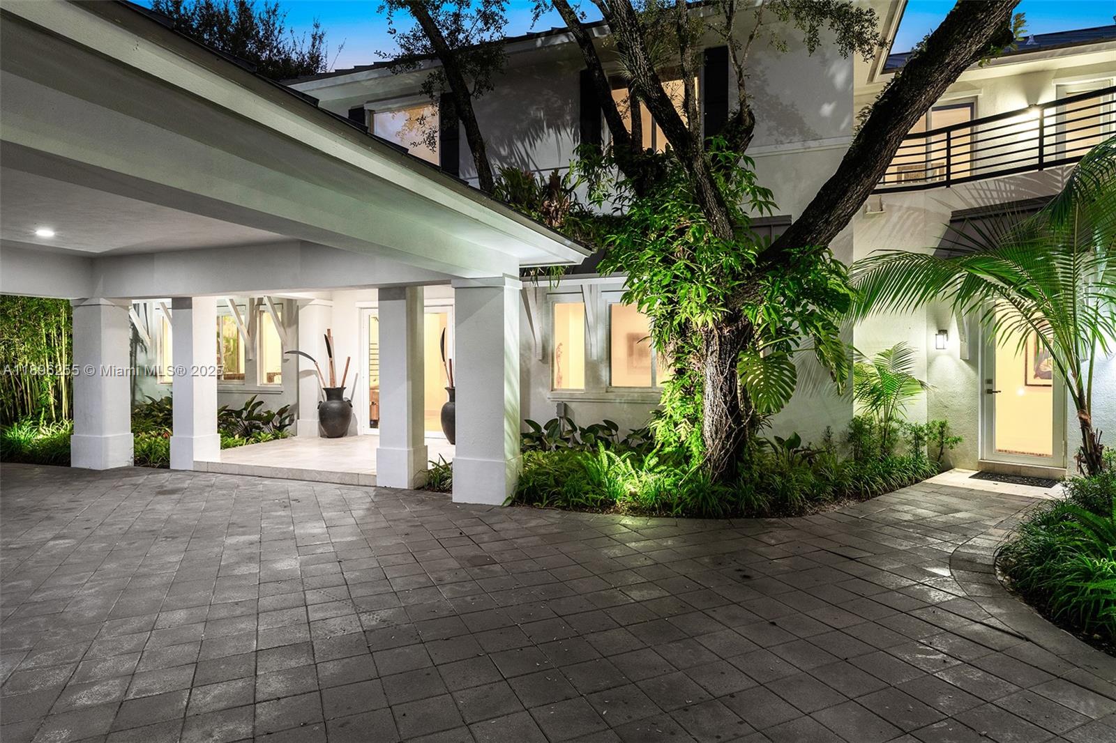 8923 Ludlam Road Pinecrest, FL 33156 - Photo 8 of 69 a view of a house with a garden