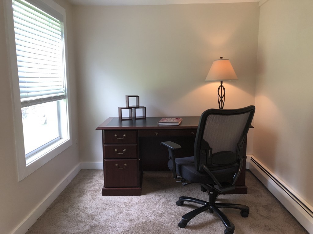 57 Middle Road Amesbury, MA 01913 - Photo 13 of 20 a view of a workspace with furniture and a window