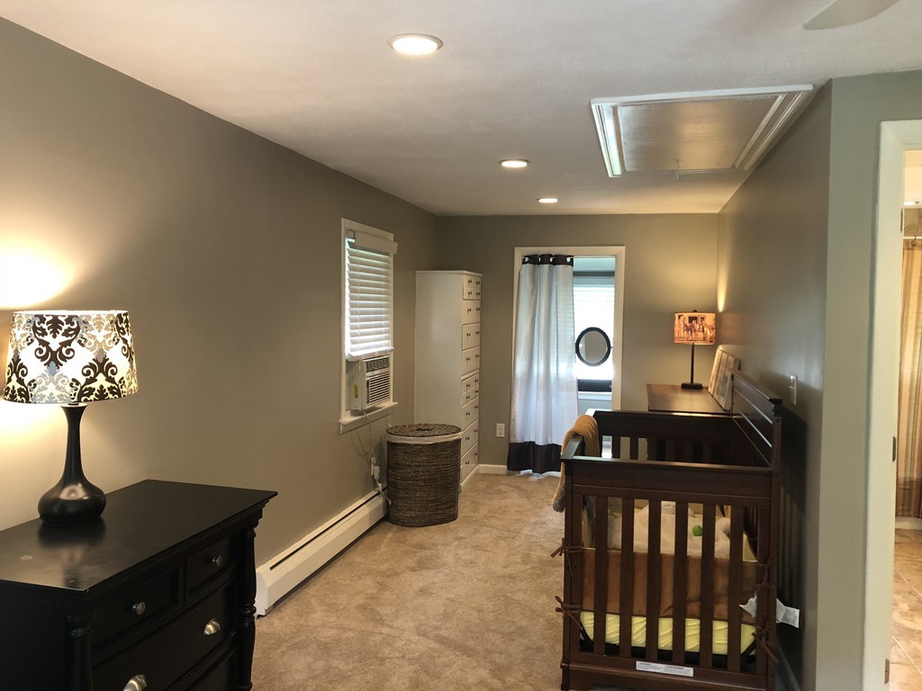 57 Middle Road Amesbury, MA 01913 - Photo 10 of 20 a view of a livingroom with furniture and a window