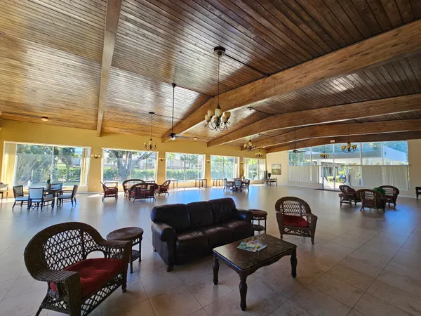 a view of a porch with furniture and a table