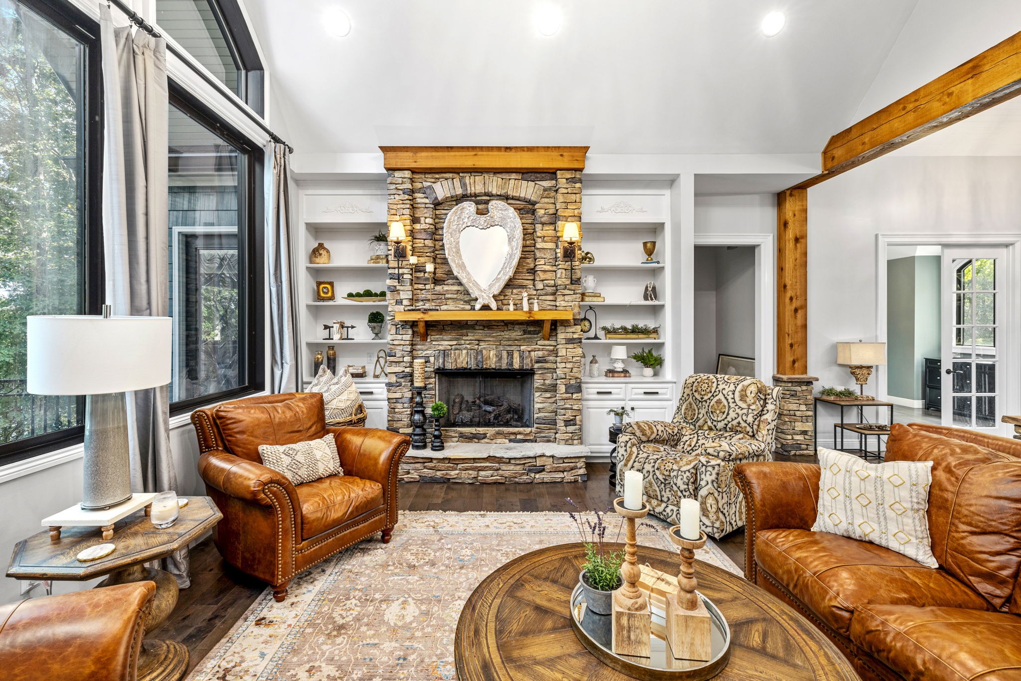 74 Pine Lake Road Summertown, TN 38483 - Photo 15 of 90 a living room with furniture a large window and a fireplace