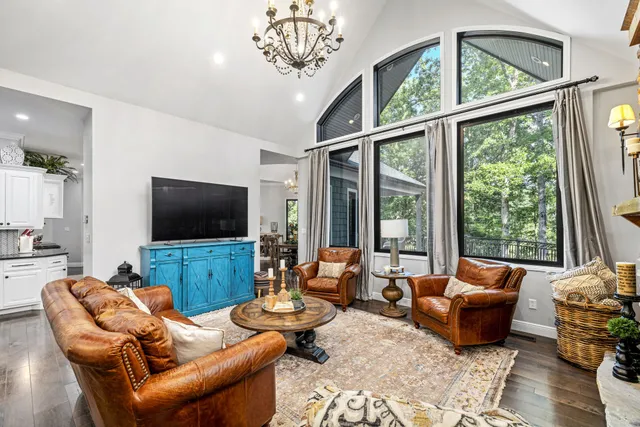 a view of a livingroom with furniture and staircase