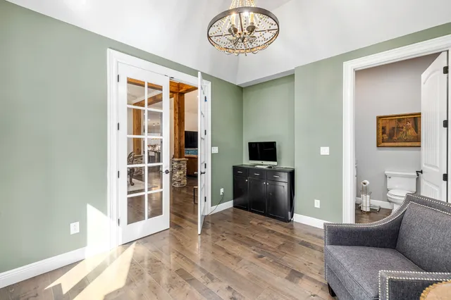 a kitchen with stainless steel appliances granite countertop a stove a sink and a white cabinets