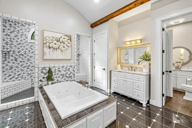 an empty room with wooden floor and a ceiling fan