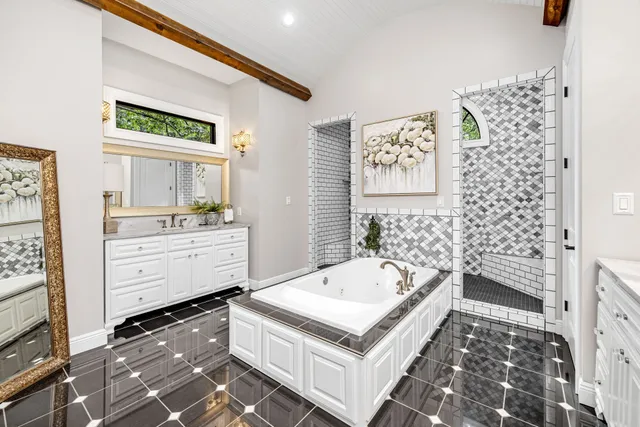 a bathroom with a granite countertop sink a toilet and a shower